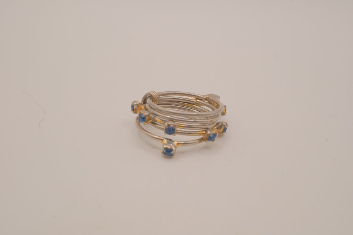 Vintage multi-band harem ring featuring blue stones