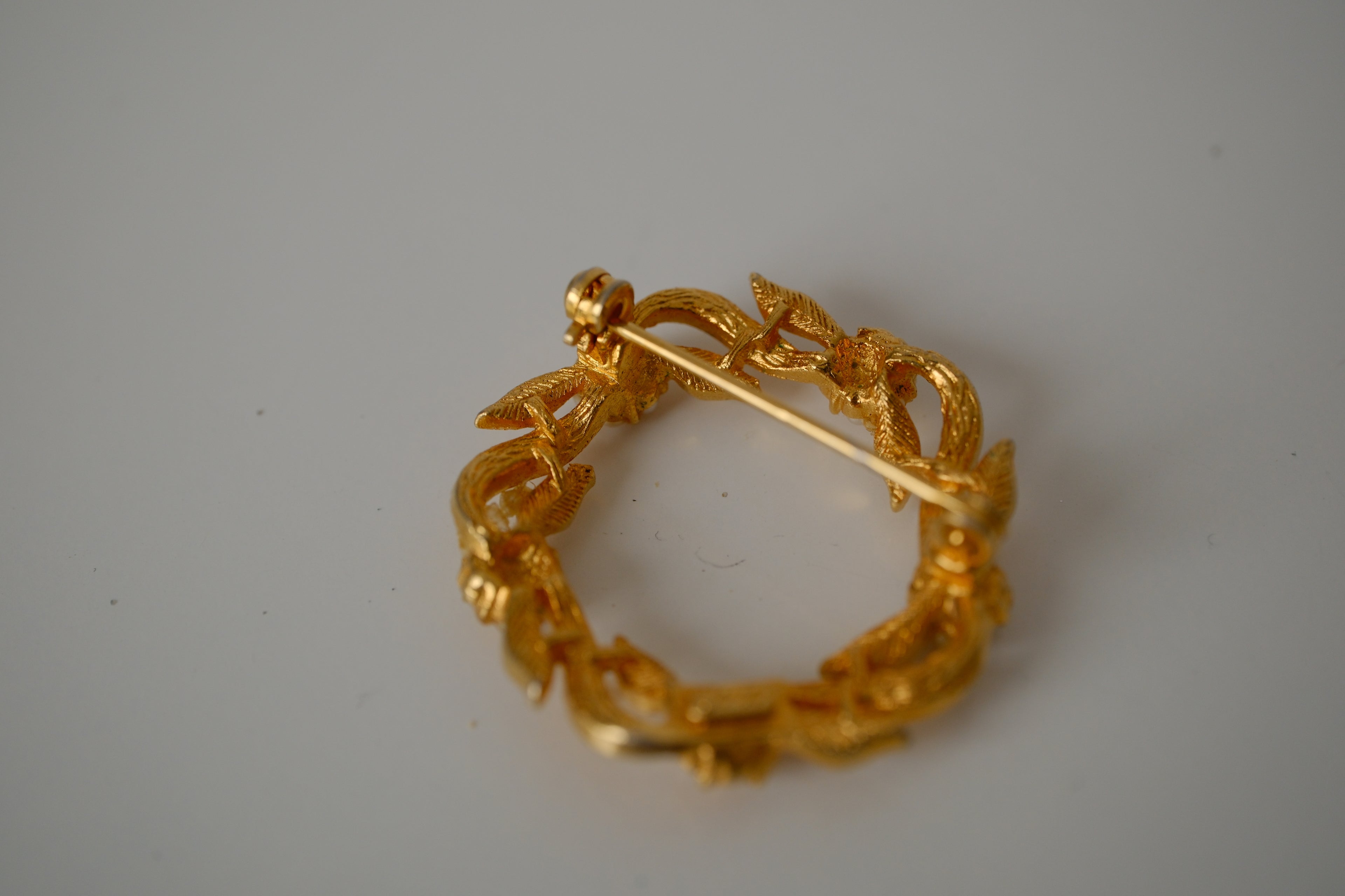 Vintage Coro gold-toned wreath brooch