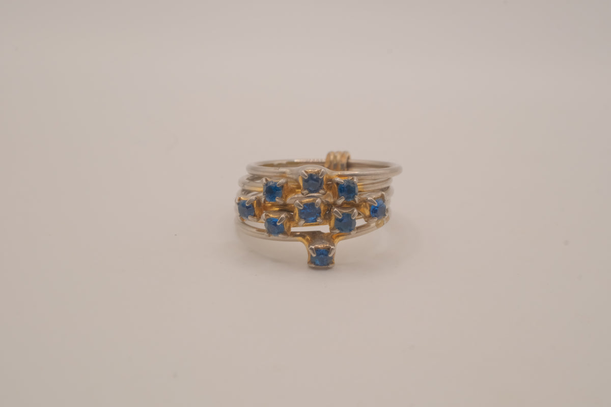 Vintage multi-band harem ring featuring blue stones