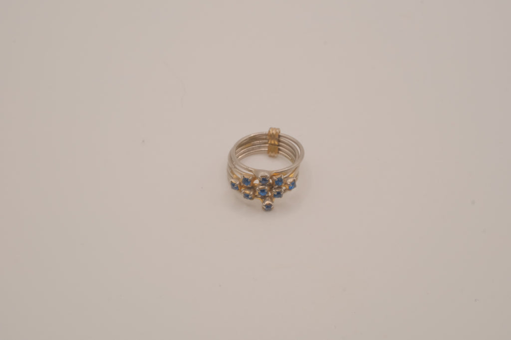 Vintage multi-band harem ring featuring blue stones