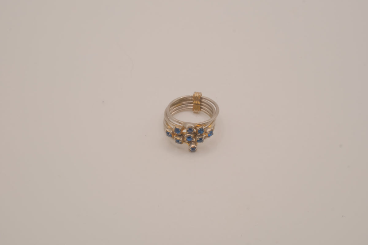 Vintage multi-band harem ring featuring blue stones