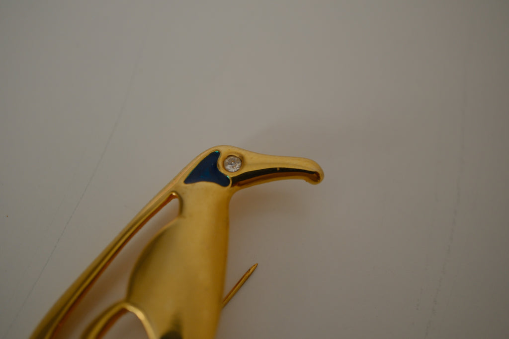 Vintage gold-toned stylized penguin