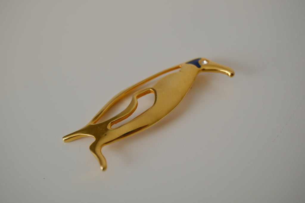 Vintage gold-toned stylized penguin