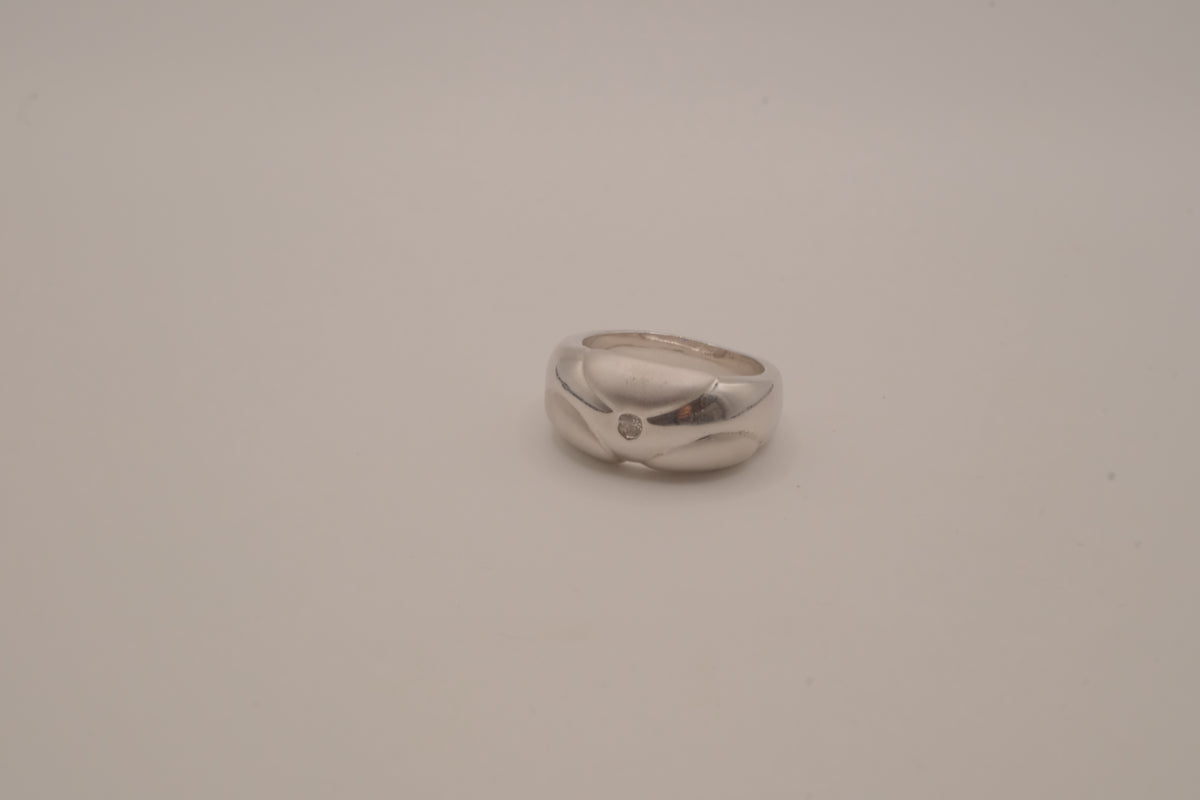 Modernist silver tone flush-set stone ring