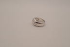 Modernist silver tone flush-set stone ring