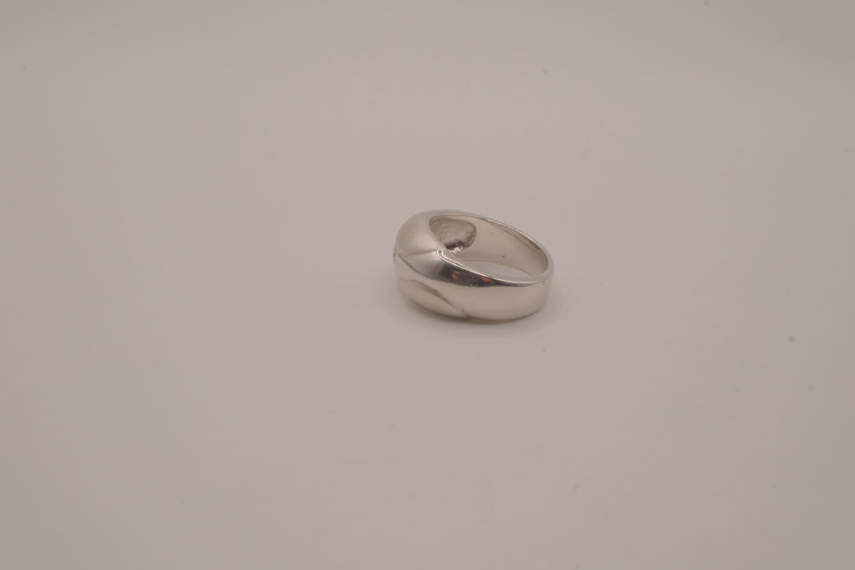 Modernist silver tone flush-set stone ring
