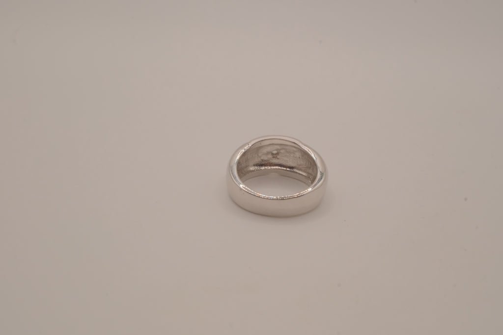 Modernist silver tone flush-set stone ring