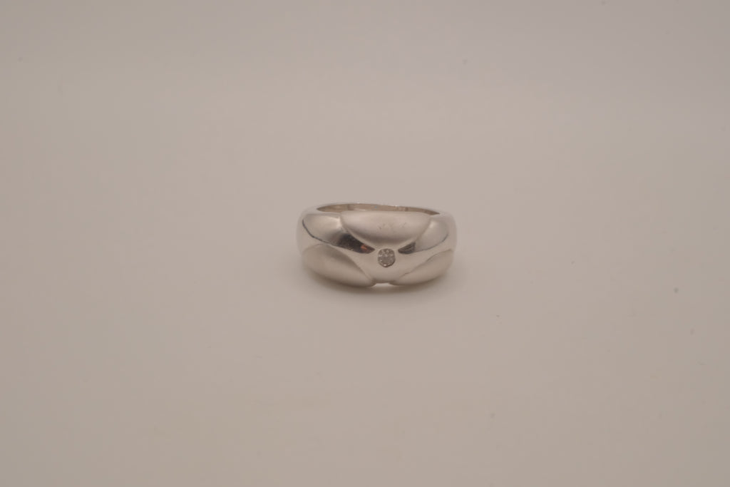 Modernist silver tone flush-set stone ring