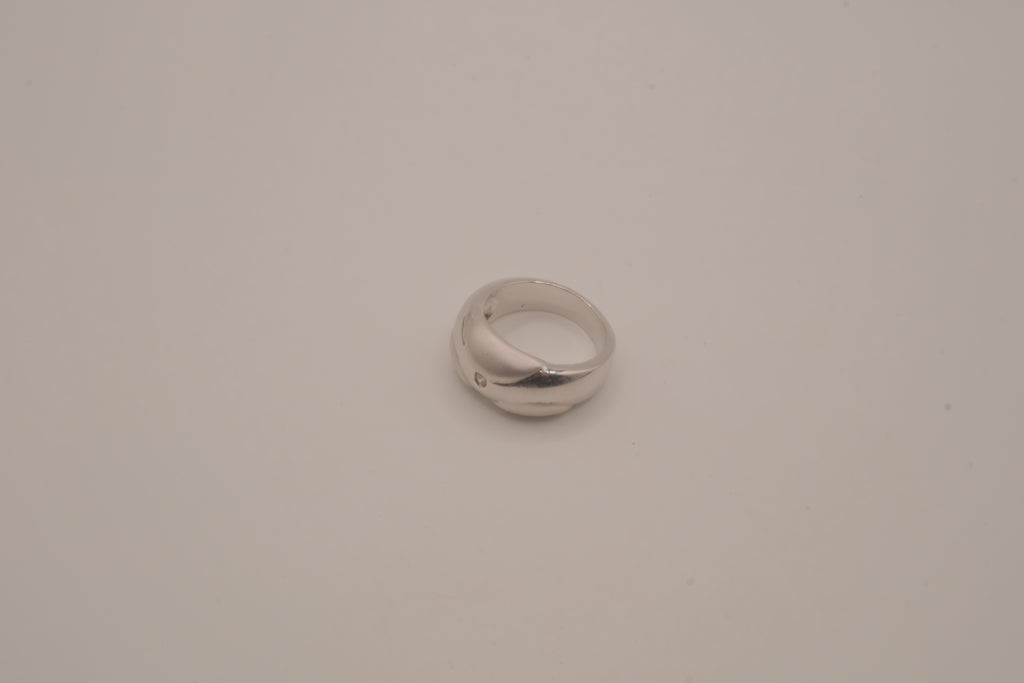 Modernist silver tone flush-set stone ring