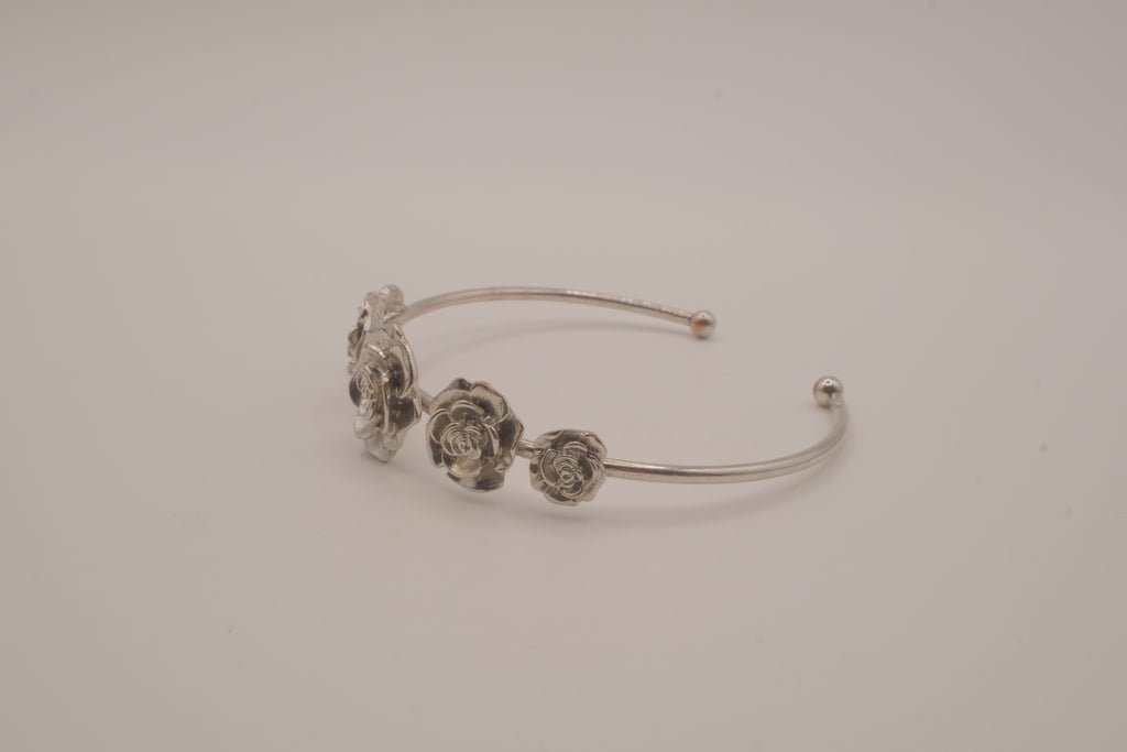 Silver tone rose cuff bracelet