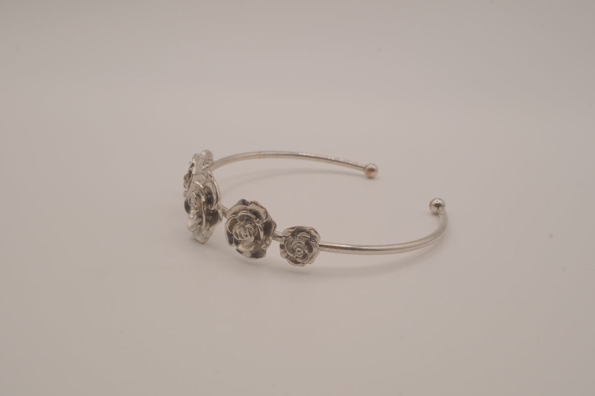 Silver tone rose cuff bracelet