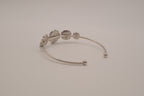 Silver tone rose cuff bracelet