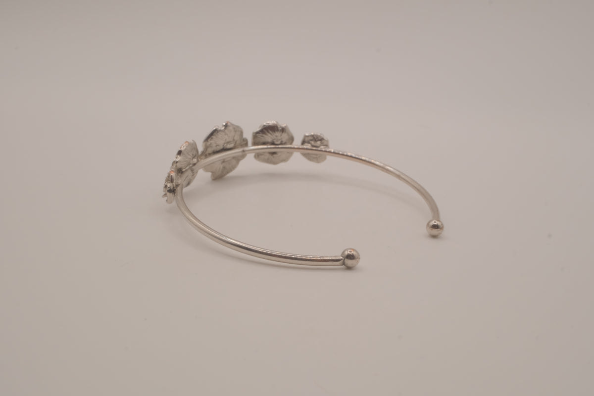 Silver tone rose cuff bracelet
