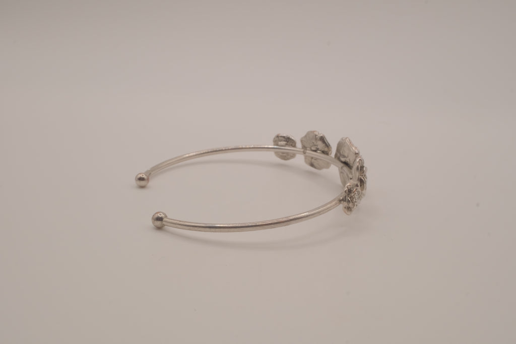 Silver tone rose cuff bracelet
