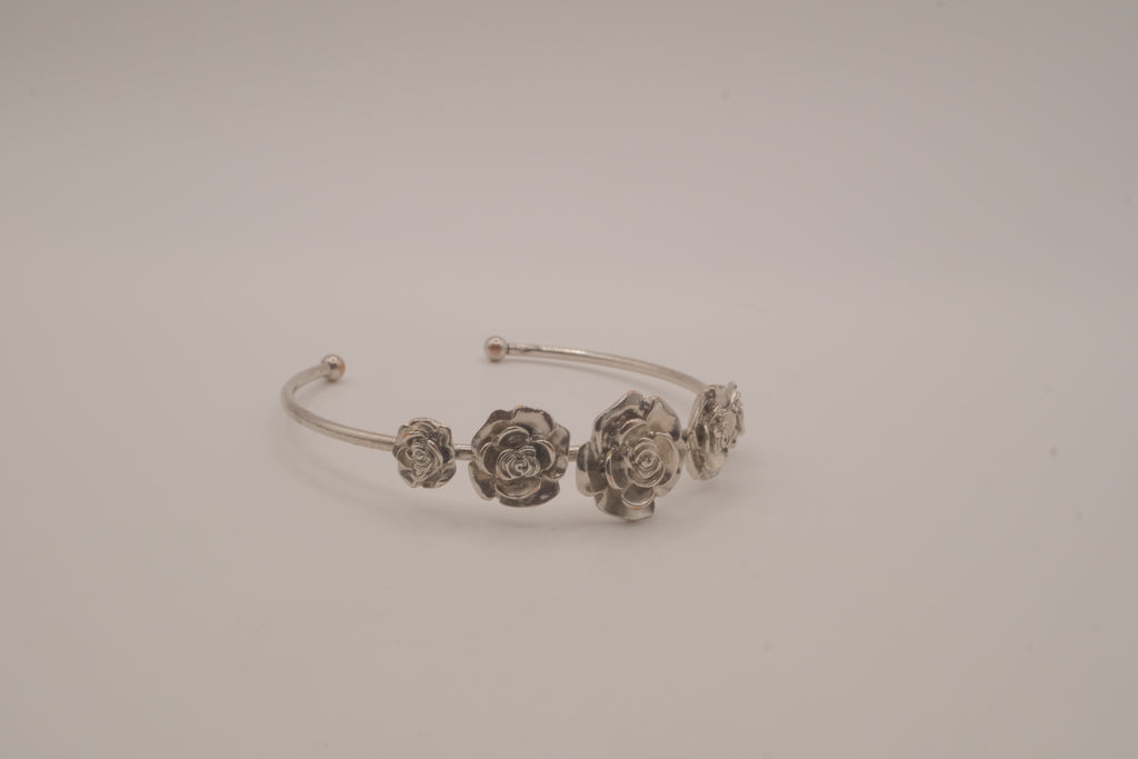 Silver tone rose cuff bracelet