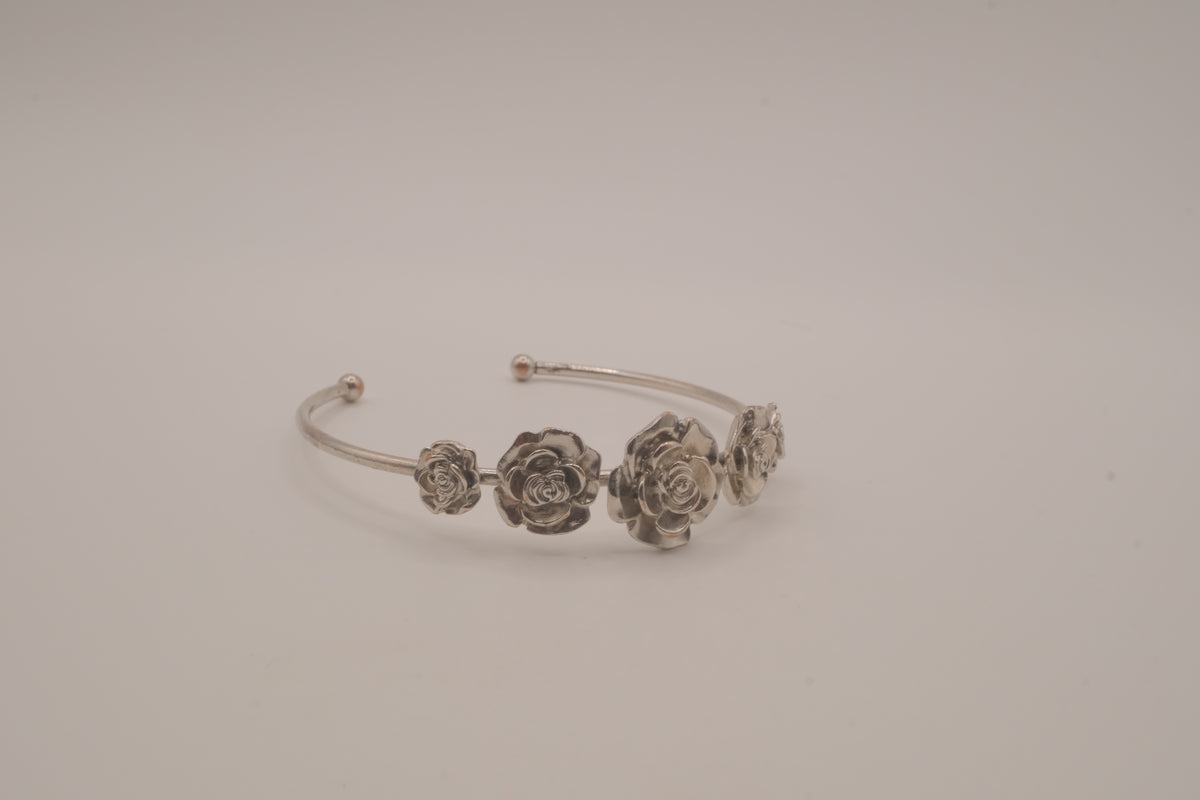 Silver tone rose cuff bracelet