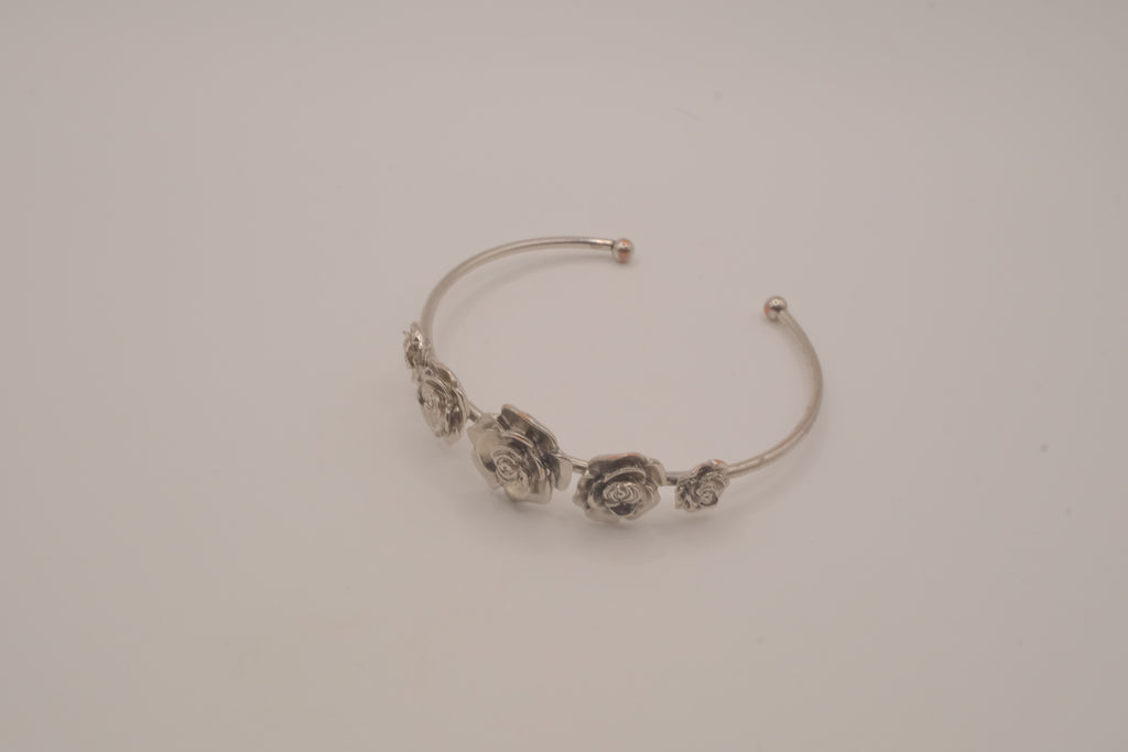 Silver tone rose cuff bracelet