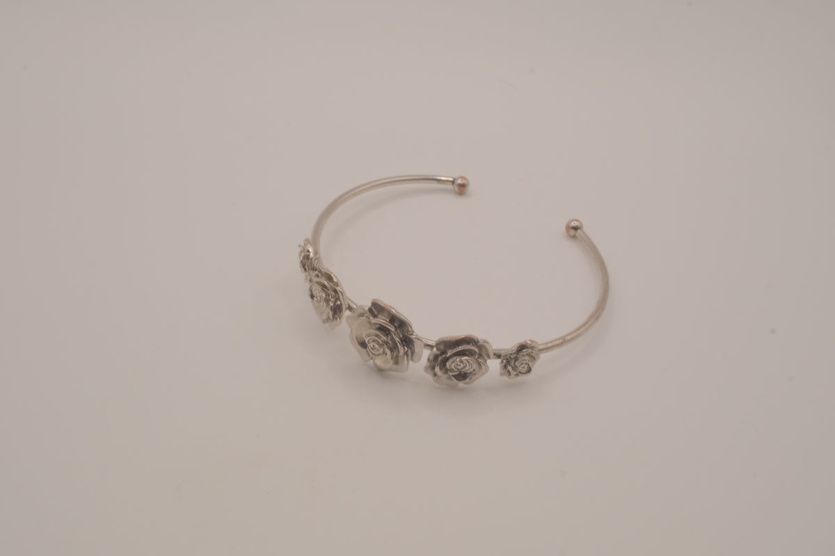 Silver tone rose cuff bracelet