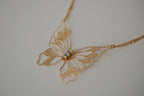 Gold butterfly filigree necklace