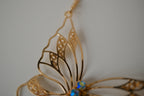 Gold butterfly filigree necklace