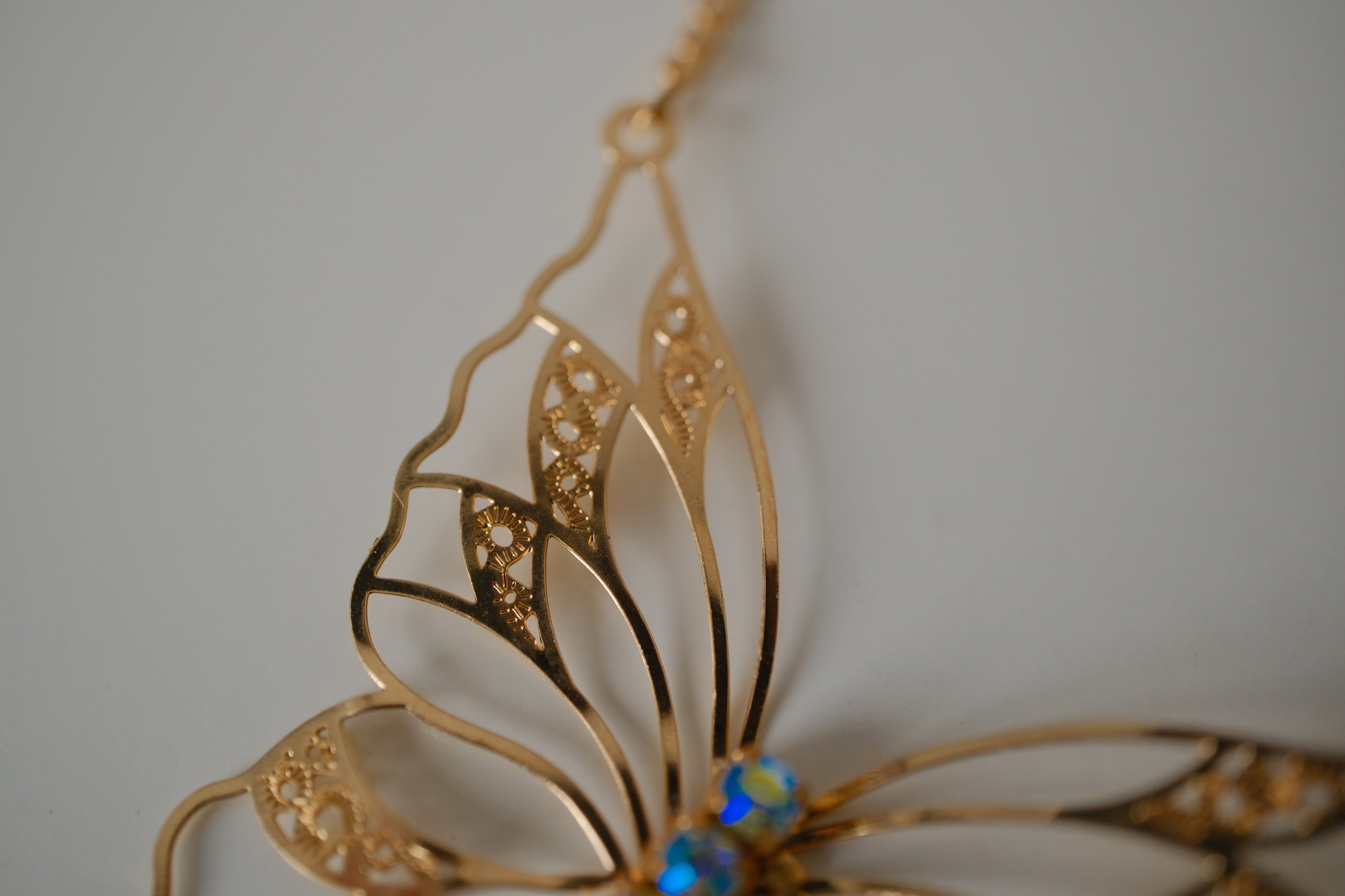 Gold butterfly filigree necklace