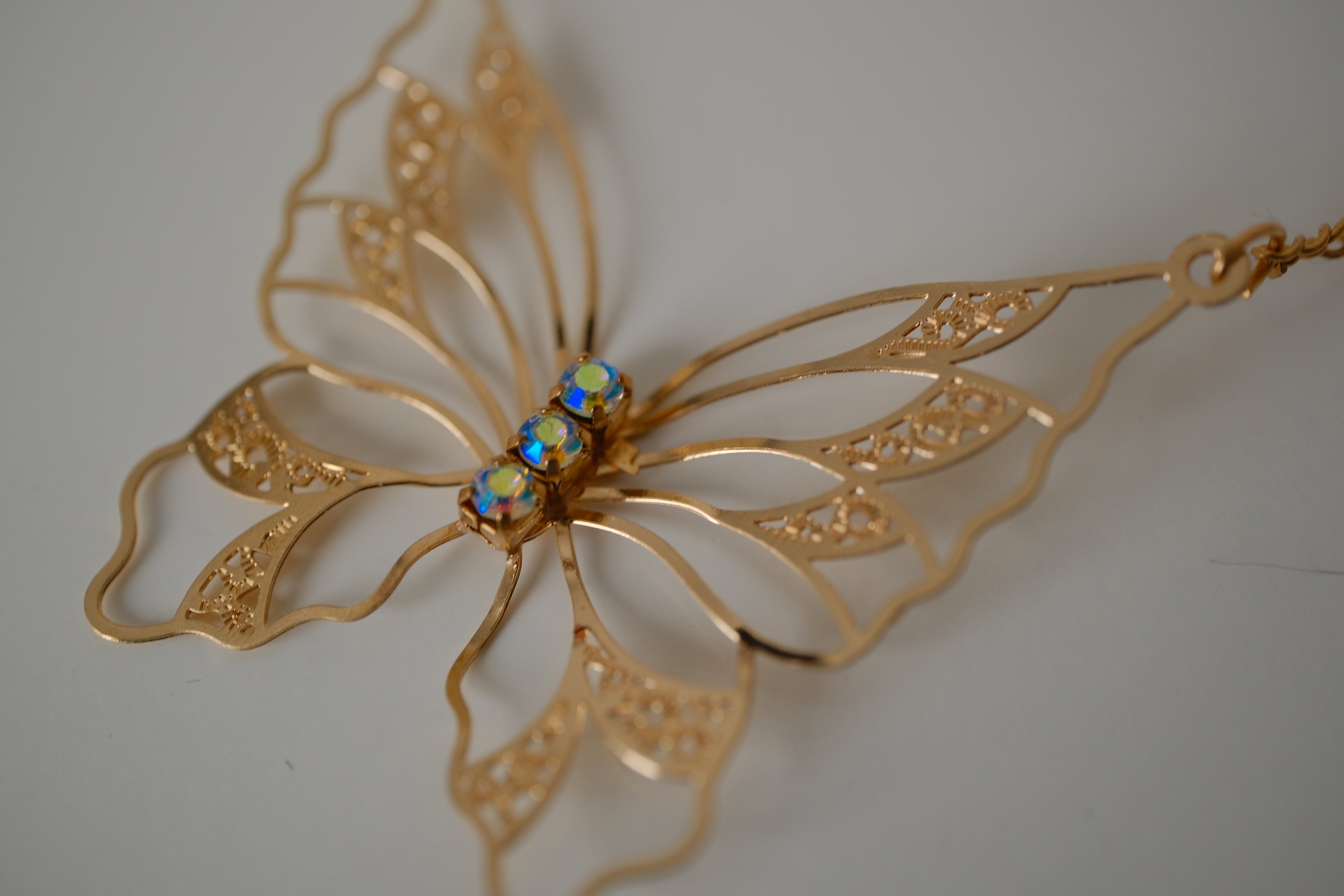 Gold butterfly filigree necklace