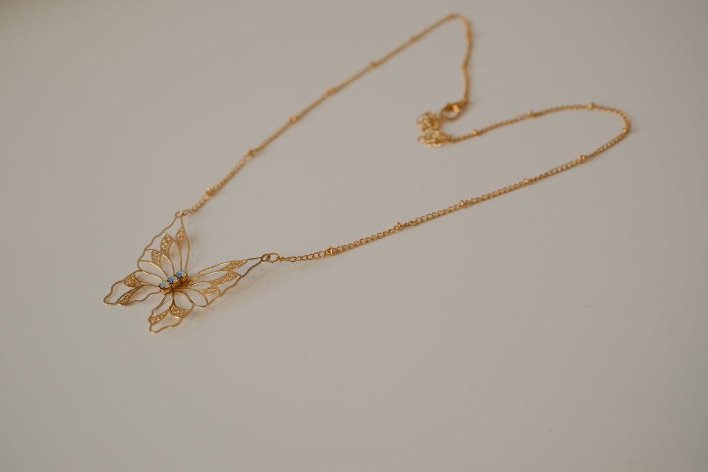 Gold butterfly filigree necklace