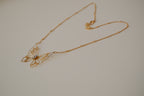 Gold butterfly filigree necklace