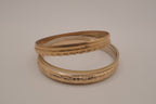 Gold tone 5 set textured stacked bangle bracelets