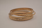 Gold tone 5 set textured stacked bangle bracelets