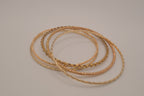 Gold tone 5 set delicate textured stacked bangle bracelets