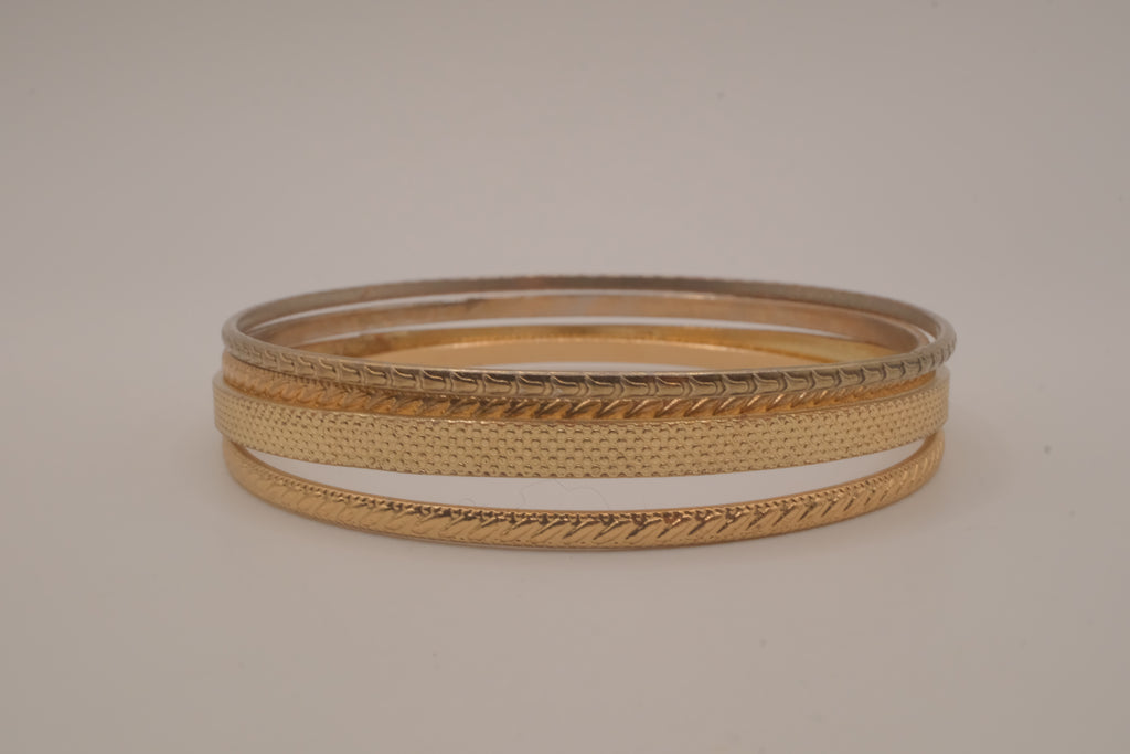 Set of 4 textured gold-tone stacking bangle bracelets