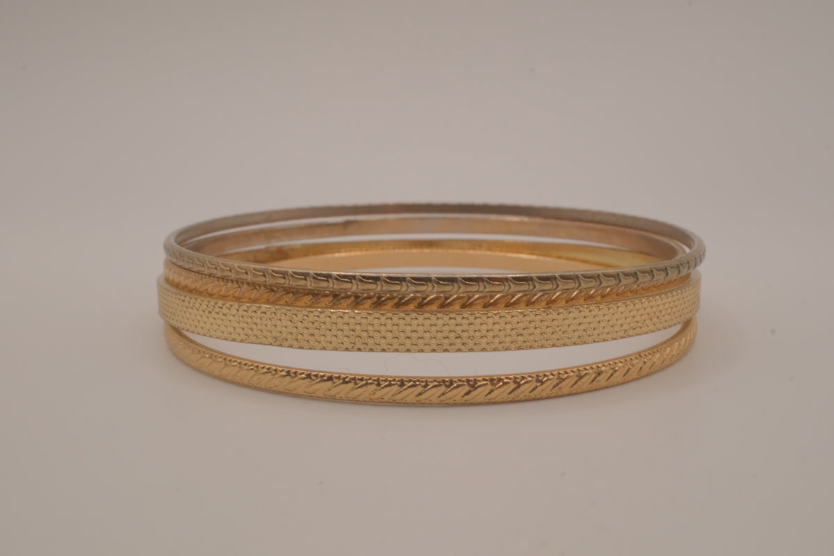 Set of 4 textured gold-tone stacking bangle bracelets