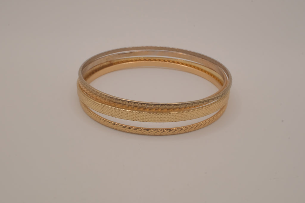 Set of 4 textured gold-tone stacking bangle bracelets