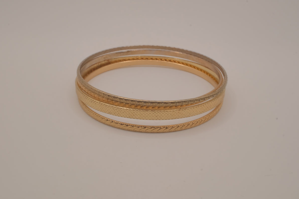Set of 4 textured gold-tone stacking bangle bracelets