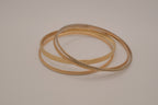 Set of 4 textured gold-tone stacking bangle bracelets