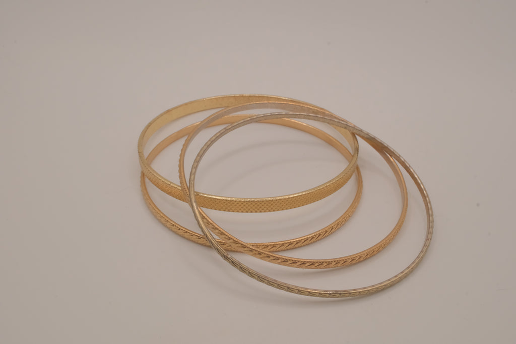 Set of 4 textured gold-tone stacking bangle bracelets