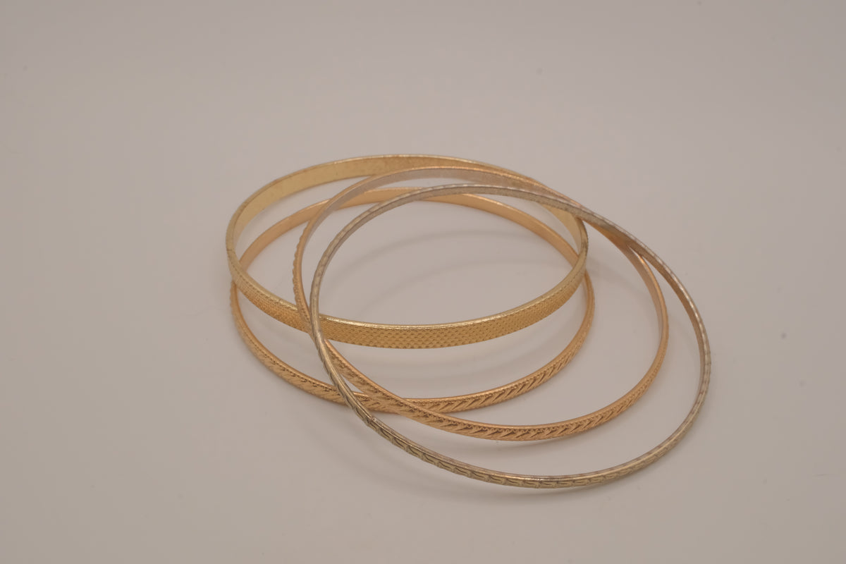 Set of 4 textured gold-tone stacking bangle bracelets