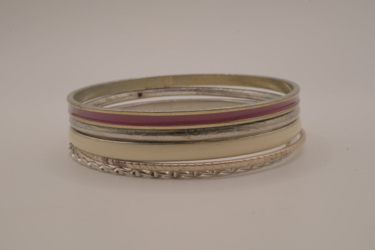 Set of 5 textured silver tone and enamel stacking bangle bracelets
