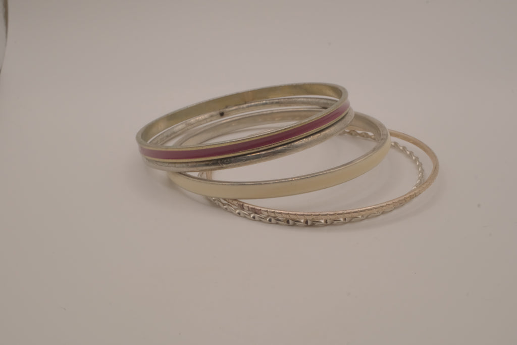 Set of 5 textured silver tone and enamel stacking bangle bracelets