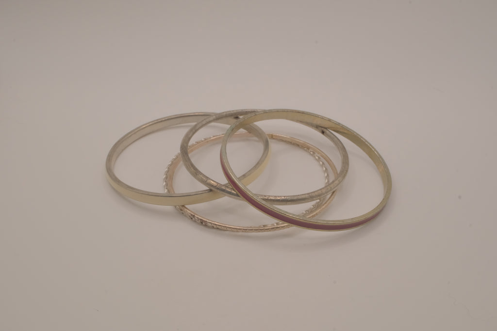 Set of 5 textured silver tone and enamel stacking bangle bracelets