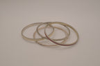 Set of 5 textured silver tone and enamel stacking bangle bracelets