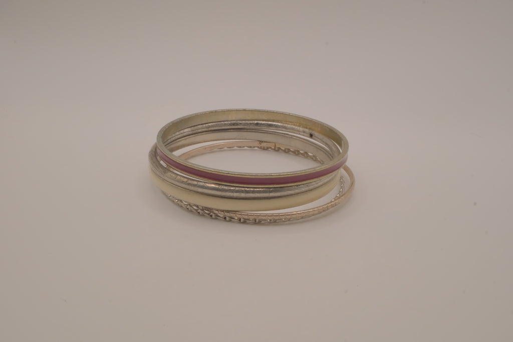 Set of 5 textured silver tone and enamel stacking bangle bracelets