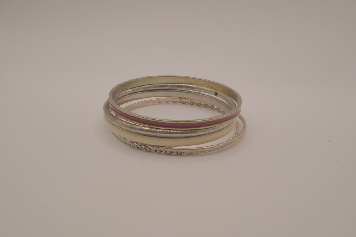 Set of 5 textured silver tone and enamel stacking bangle bracelets