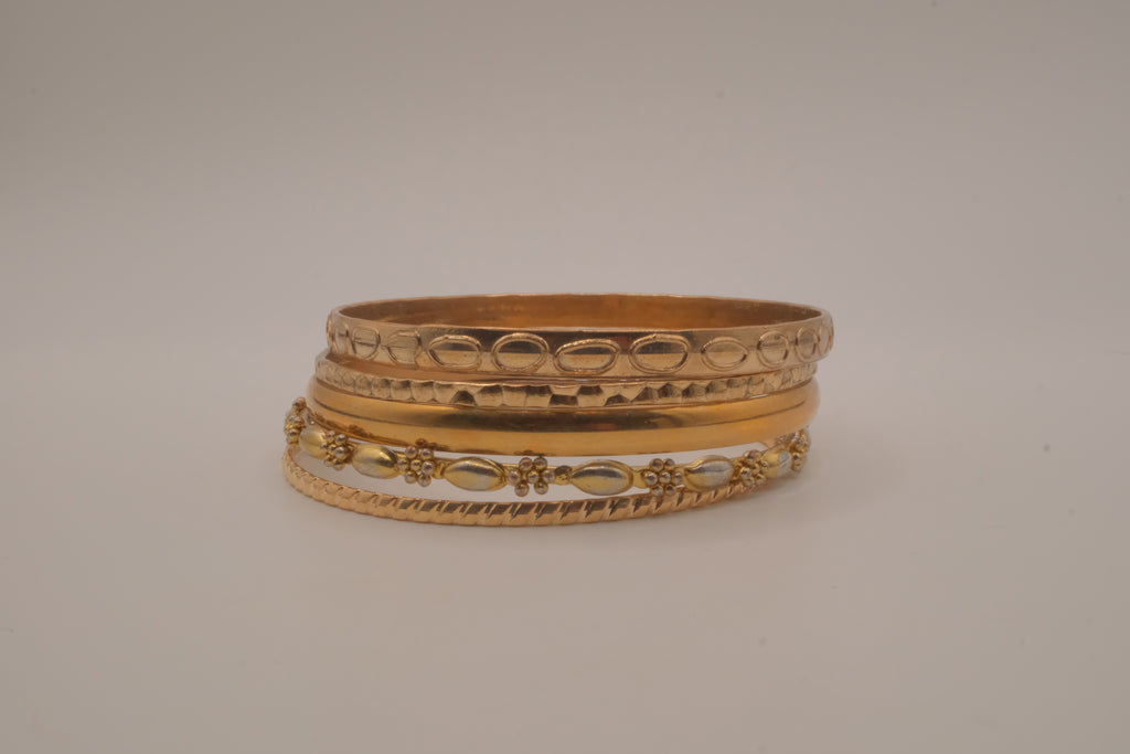 Set of 5 textured and engraved gold tone stacking bangle bracelets