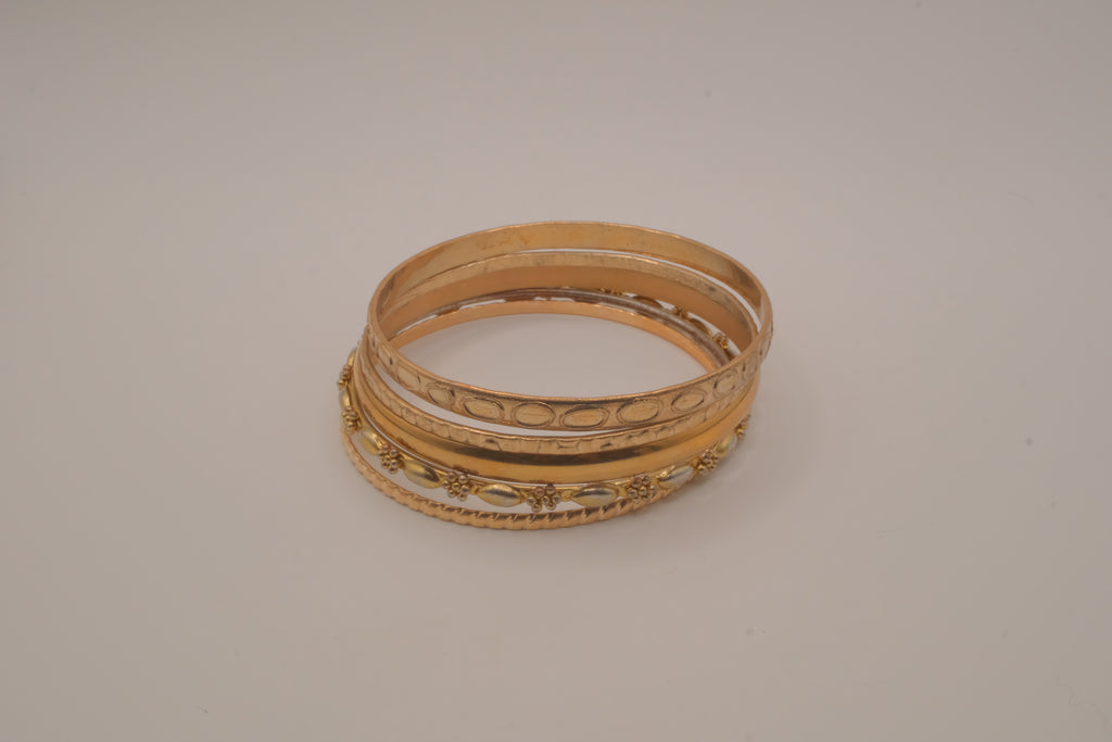 Set of 5 textured and engraved gold tone stacking bangle bracelets