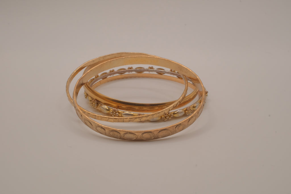 Set of 5 textured and engraved gold tone stacking bangle bracelets