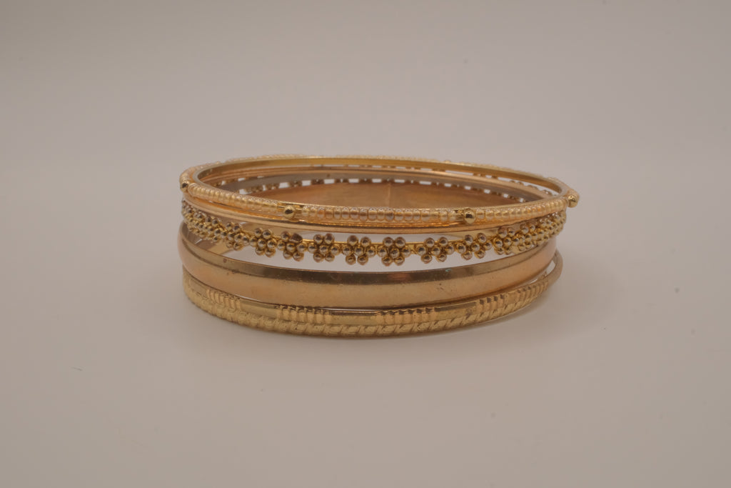 Set of 6 textured and floral gold-tone bangles