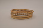 Set of 6 textured and floral gold-tone bangles