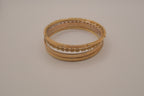 Set of 6 textured and floral gold-tone bangles